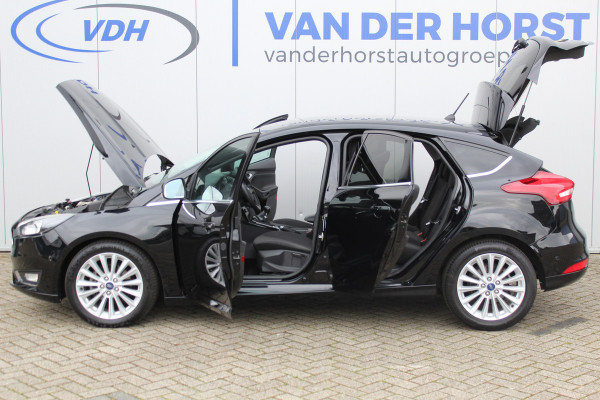 Ford Focus 1.0-125pk Titanium. Nette en goed onderhouden Ford Focus hatchback in de luxe Titanium uitvoering. Volautm. airco dual, cruise control, navigatie, telefoonvoorb., keyless entry-keyless go, LM wielen, verwarmd voorraam, parkeersensoren v~a etc.