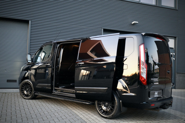 Ford Transit Custom 320 2.0 TDCI 170PK AUT L2H1 Limited | L+R Schuifdeur | Navigatie | Camera | CarPlay | Raptor Edition | Stoelverwarming | Trekhaak | 3-Zitter | Nieuwe APK | Onderhoudsbeurt