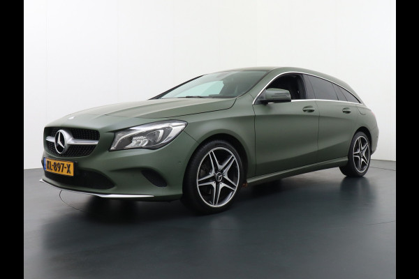 Mercedes-Benz CLA-Klasse Shooting Brake 180 18"Lmv AMG Sportstoelen Navi High-performance-LED Pdc Cruise Night Pakket Urban Pakket Control Ambition Zitcomfortpakket Parkeerpilot Led Bluetooth Camtronic Privacy Glas Garmin® MAP PILOT Voorzien van een Groen-grijze-wrap