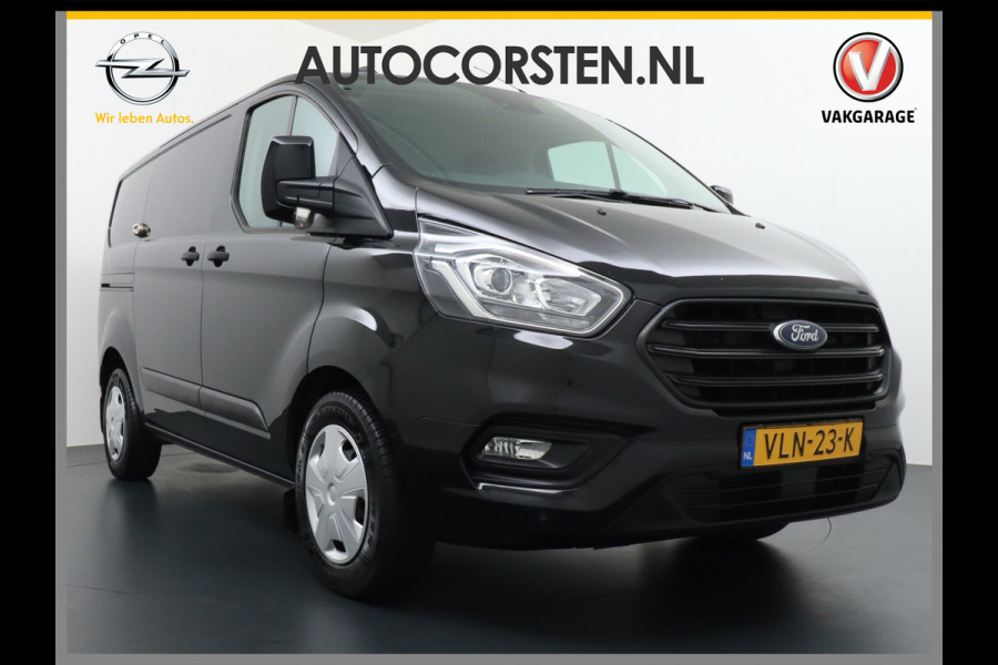 Ford Transit Custom 2.0D 130PK L1H1 3pers. Airco PDC-a+v Trekhaak Cruise-Controle voorruit verwarmbaar Betonplex Schuifdeur-r Tussenwand voorruit ve Adaptieve bochtverl. Projector-koplamp mistlampen regen-/lichtsensor Dieselroetfilter Supervergrendeling EURO 6 385Nm 2.500kg Trekvermogen!