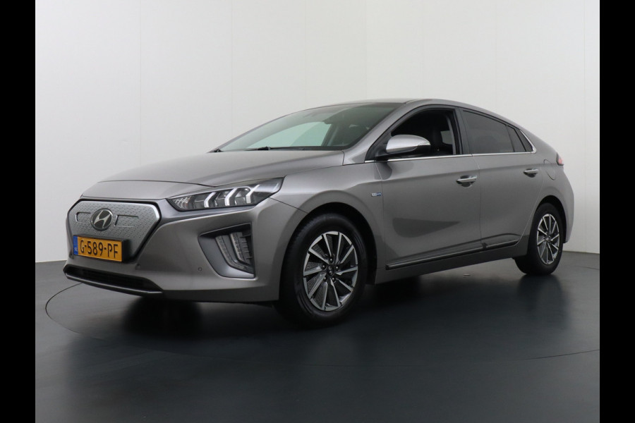 Hyundai IONIQ Premium EV 38kWh Apple Carplay Android Auto Navi Ecc Leder Elec.Stoel + Verwarming/ventilatie Stuurverwarming Camera DAB Keyless Cruise Control Led Infinity® Luidsprekers Achterbank verwarmd Bluetooth Dodehoek detector Draadloze tel.lader 1e Eigenaar