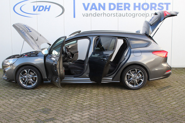 Ford FOCUS Wagon 1.0-125pk EcoBoost ST-Line AUTOMAAT ! Heel erg nette en goed onderhouden Ford Focus ST-Line wagon automaat. Volautm. airco dual, stoel-, stuur- en voorraamverw., camera, trekhaak, navigatie, telefoonvoorb., LM wln, cruise cntrl, skiluik etc., etc....