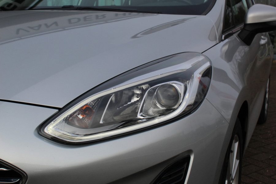 Ford Fiesta 1.0-100pk EcoBoost Titanium 5drs. Uiterst nette, luxe en zuinige Ford Fiesta. Voalautm. airco, Cruise control, Navigatie, LM wielen, Metallic lak, Parkeersensoren achter, Telefoonvoorb., Lane assist etc.