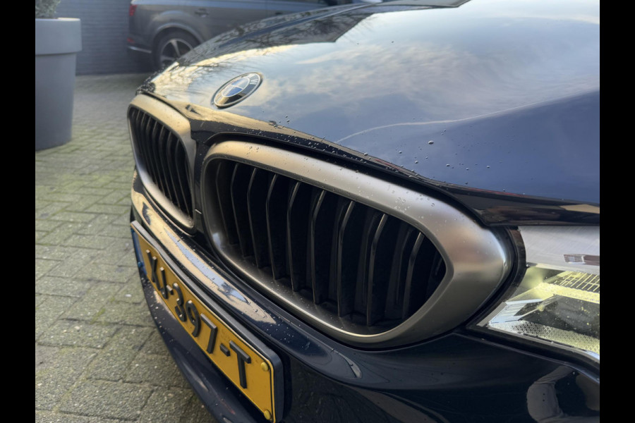 BMW 5 Serie M550i xDrive High Executive | Panoramadak | Head-Up Display | Harmon Kardon | Camera | Stoel Ventilatie/Verwarming |