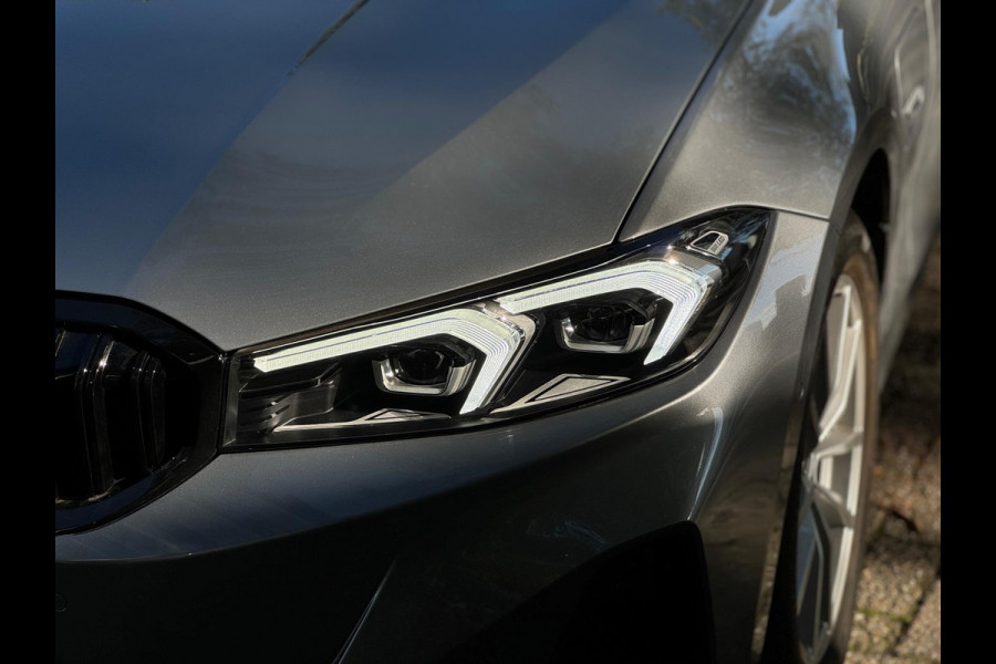 BMW 3 Serie Touring 320e Nieuwstaat AUT Pano Plug in hybrid Wide screen Elek.Trekhaak Stoelverwarming Adaptive LED