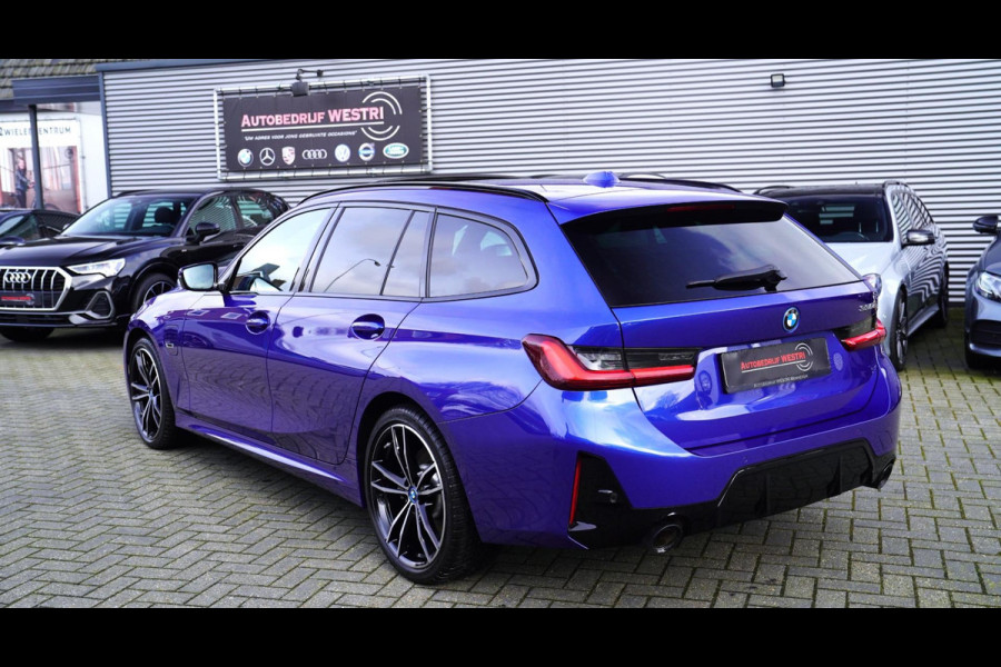 BMW 3 Serie Touring 330e High Executive | M-pakket | Facelift 2022 | Widescreen | Panorama | Adaptieve cruise | Portimao Blau |