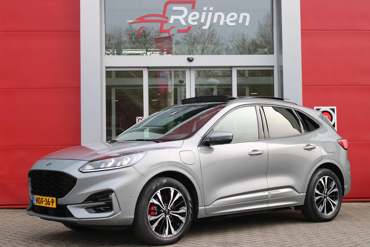 Ford Kuga 2.5 225PK PHEV ST-LINE | PANORAMISCH SCHUIF/KANTEL DAK | ELEKTRISCH BEDIENBARE ACHTERKLEP | FULL LED KOPLAMPEN | 360° CAMERA | KEYLESS ENTRY/START | CLIMATE CONTROL | ADAPTIVE CRUISE CONTROL | DAB+ RADIO | DRAADLOZE TELEFOONLADER | NAVIGATIE | APPLE CARPLAY/ANDROID AUTO | DODEHOEK DETECTIE |