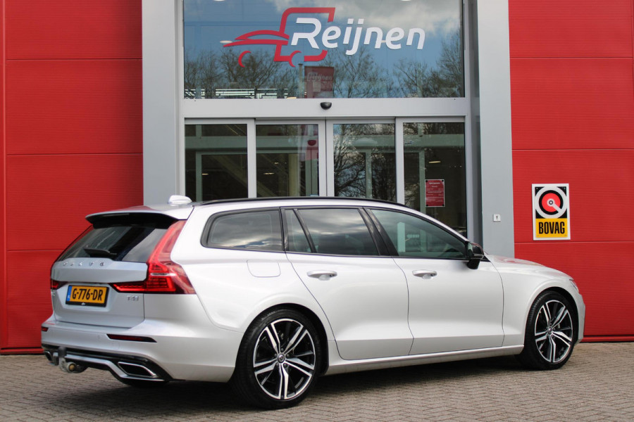 Volvo V60 2.0 T4 R-DESIGN 190PK AUTOMAAT | ZEER LAGE KILOMETERSTAND | 19" 5 TRIPPLE SPAAKS BLACK / DIAMOND CUT LICHTMETALEN VELGEN | ELEKTRISCH WEGKLAPBARE TREKHAAK | 1800KG TREKGEWICHT! | NAVIGATIE | APPLE CARPLAY/ANDROID AUTO | ACTIVE HIGH BEAM FULL LED KOPLAMPEN | ACHTERUITRIJ CAMERA | PARKEERSENSOREN VOOR EN ACHTER | LEDEREN BEKLEDING | STOEL VERWARMING | ELEKTRISCH BEDIENBARE VOORSTOELEN MET GEHEUGENFUNCTIE | ELEKTRISCH BEDIENBARE ACHTERKLEP | ADAPTIVE CRUISE CONTROL |