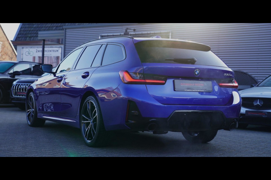 BMW 3 Serie Touring 330e High Executive | M-pakket | Facelift 2022 | Widescreen | Panorama | Adaptieve cruise | Portimao Blau |