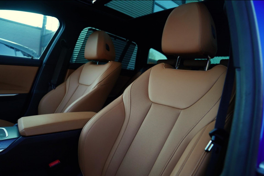 BMW 3 Serie Touring 330e High Executive | M-pakket | Facelift 2022 | Widescreen | Panorama | Adaptieve cruise | Portimao Blau |