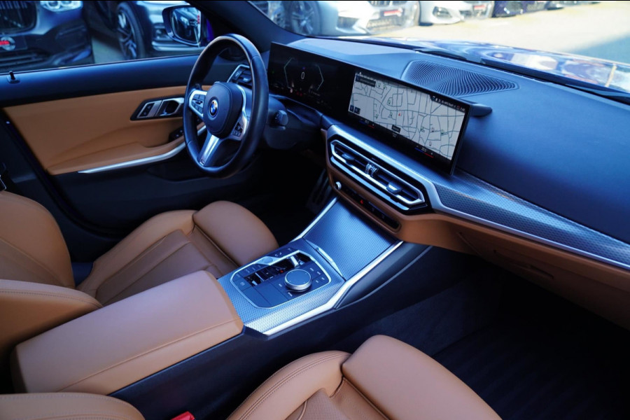 BMW 3 Serie Touring 330e High Executive | M-pakket | Facelift 2022 | Widescreen | Panorama | Adaptieve cruise | Portimao Blau |