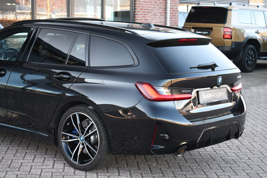 BMW 3 Serie Touring 330e M-Sport Pano Trekh ACC El-zetel HUD Carbon 19inch Adp-onderstel