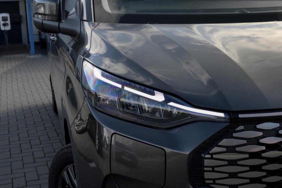 Ford E-Transit Cust. 320 L2H1 Limited 65 kWh 218pk | VOORRAAD | Inklapbare trekhaak | 17 inch lichtmetalen velgen (Carbonised Grey) | Driver Assistent Pack Premium | AGM accu | 3-fase laadkabel mode 3 32A, 10 meter | Centrale dubbele vergrendeling | Vehicle Integration System