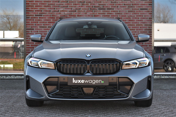 BMW 3 Serie Touring 320e M-Sport ACC HUD Sfeer Camera HiFi Stuurverw