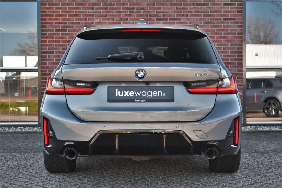 BMW 3 Serie Touring 320e M-Sport ACC HUD Sfeer Camera HiFi Stuurverw