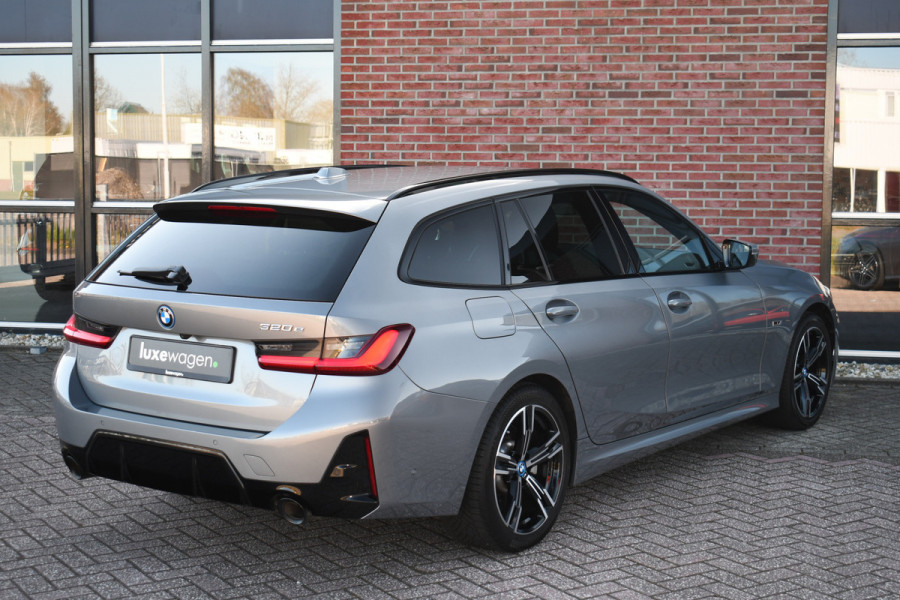 BMW 3 Serie Touring 320e M-Sport ACC HUD Sfeer Camera HiFi Stuurverw