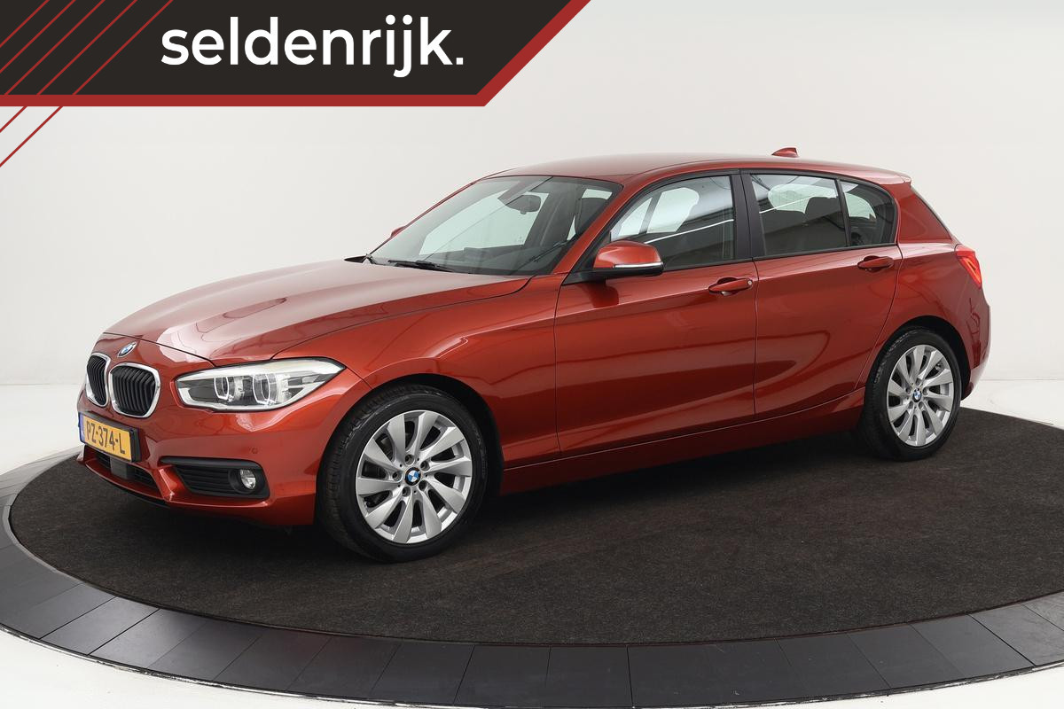 BMW 1-serie 118i High Executive | Adaptive cruise | Leder | Trekhaak | Stoelverwarming | Full LED | Navigatie | PDC | Climate control BMW 1-serie 118i High Executive | Adaptive cruise | Leder | Trekhaak | Stoelverwarming | Full LED | Navigatie | PDC | Climate control