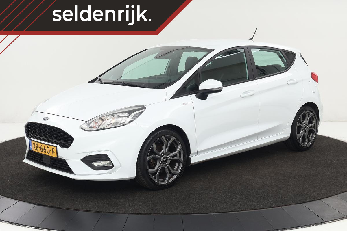 Ford Fiesta 1.0 EcoBoost ST-Line | Stoel & stuurverwarming | Camera | Carplay | Climate control | Sportstoelen | Cruise control | PDC | Bluetooth Ford Fiesta 1.0 EcoBoost ST-Line | Stoel & stuurverwarming | Camera | Carplay | Climate control | Sportstoelen | Cruise control | PDC | Bluetooth