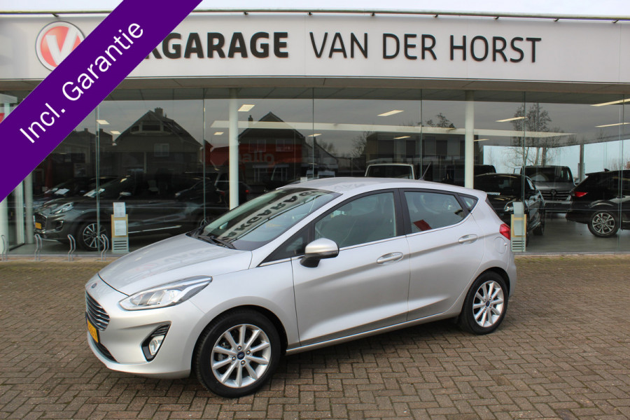Ford Fiesta 1.0-100pk EcoBoost Titanium 5drs. Uiterst nette, luxe en zuinige Ford Fiesta. Voalautm. airco, Cruise control, Navigatie, LM wielen, Metallic lak, Parkeersensoren achter, Telefoonvoorb., Lane assist etc.