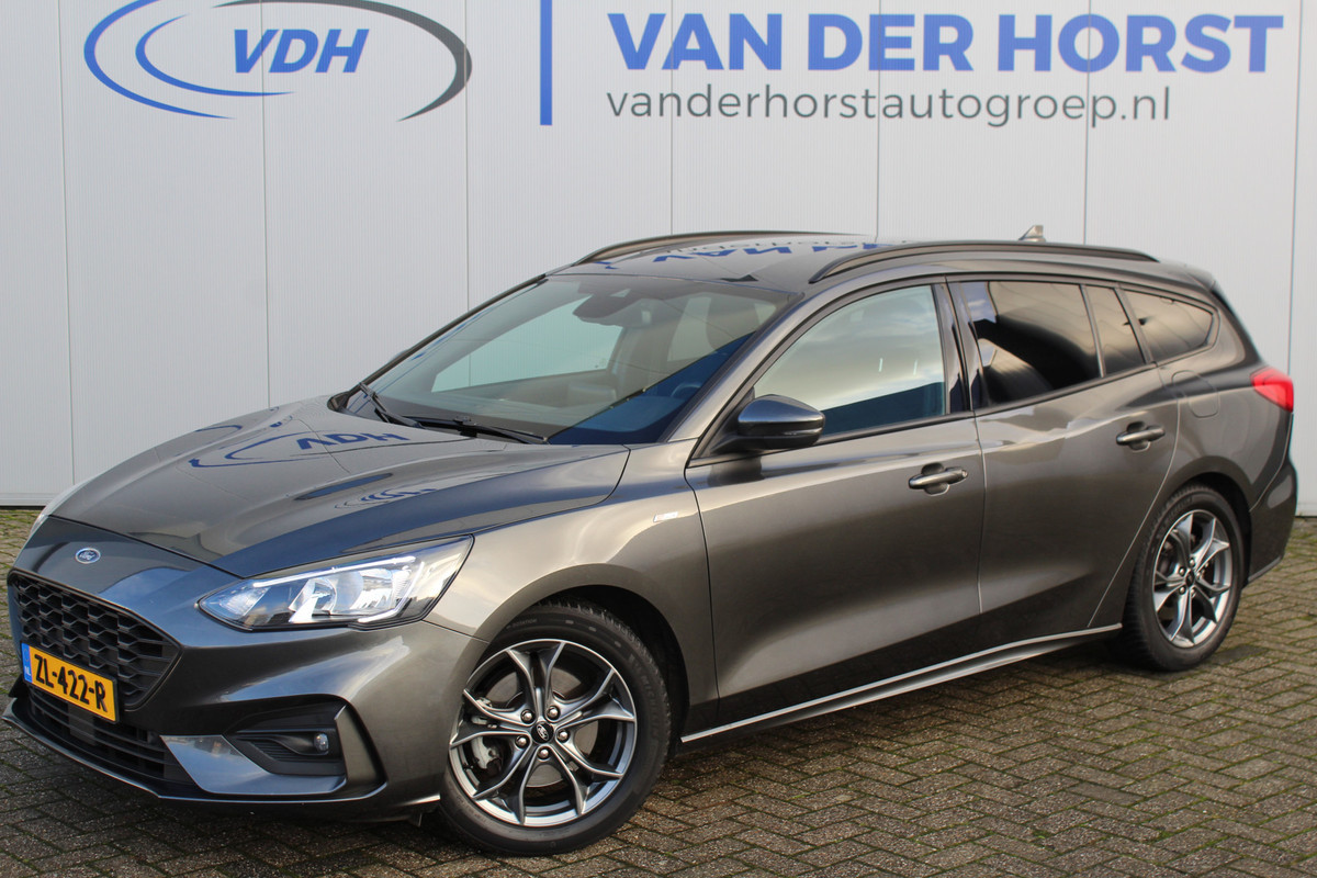 Ford FOCUS Wagon 1.0-125pk EcoBoost ST-Line AUTOMAAT ! Heel erg nette en goed onderhouden Ford Focus ST-Line wagon automaat. Volautm. airco dual, stoel-, stuur- en voorraamverw., camera, trekhaak, navigatie, telefoonvoorb., LM wln, cruise cntrl, skiluik etc., etc.... Ford FOCUS Wagon 1.0-125pk EcoBoost ST-Line AUTOMAAT ! Heel erg nette en goed onderhouden Ford Focus ST-Line wagon automaat. Volautm. airco dual, stoel-, stuur- en voorraamverw., camera, trekhaak, navigatie, telefoonvoorb., LM wln, cruise cntrl, skiluik etc., etc....