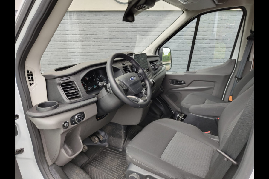 Ford Transit 350 D130pk L4H3 Navi Camera Pdc Apple Carplay Android WiFi-vb Airco Cruise Control Voorruit-Verwarmd 2.0TDCI Regensensor DAB Schuifdeur Betonplex Vloer Wandbetimmering Roll Stability Control Led Spoorwisselassist Euro 6 Zeer Compleet!
