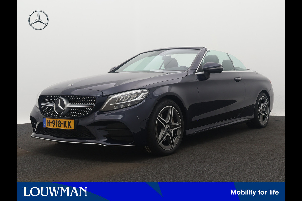 Mercedes-Benz C-Klasse Cabrio 200 Premium Plus Pack | 5 spaaks lichtmetalen velgen | Navigatie | Parking support met Camera achter | Louwman Basispakket met 1 jaar Bovag Garantie. Mercedes-Benz C-Klasse Cabrio 200 Premium Plus Pack | 5 spaaks lichtmetalen velgen | Navigatie | Parking support met Camera achter | Louwman Basispakket met 1 jaar Bovag Garantie.