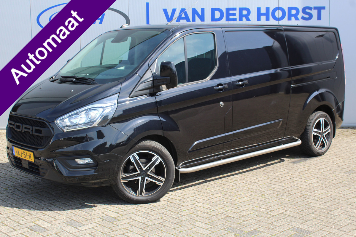 Ford Transit Custom 300 2.0-130pk TDCI L2H1 Limited AUTOMAAT ! Keurige nette en luxe Ford Transit Custom, slechts 47.000km !. Airco, schuifdeur li+re, LM wielen, stoel-, spiegel- en voorraamverw., side en lane assist, 3-zits, navigatie, telefoonvoorb., camera, pdc v+a, cruise cntrl etc. Ford Transit Custom 300 2.0-130pk TDCI L2H1 Limited AUTOMAAT ! Keurige nette en luxe Ford Transit Custom, slechts 47.000km !. Airco, schuifdeur li+re, LM wielen, stoel-, spiegel- en voorraamverw., side en lane assist, 3-zits, navigatie, telefoonvoorb., camera, pdc v+a, cruise cntrl etc.