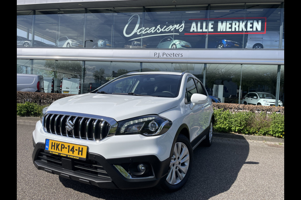 Suzuki S-Cross 1.0 Boosterjet Exclusive Climate control - Cruise control - Navi - Parkeersensoren V+A - A-uitrijcamera - MFL-stuurwiel - Apple carplay/Android auto - Mistlampen voor- LMV 17"- Ramen E-V+A - Spiegels E-Verstel en ver Suzuki S-Cross 1.0 Boosterjet Exclusive Climate control - Cruise control - Navi - Parkeersensoren V+A - A-uitrijcamera - MFL-stuurwiel - Apple carplay/Android auto - Mistlampen voor- LMV 17"- Ramen E-V+A - Spiegels E-Verstel en ver