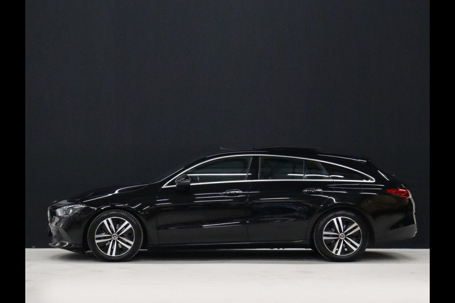 Mercedes-Benz CLA-Klasse Shooting Brake 200 Business Solution Luxury [CARPLAY, CRUISE CONTROL,SCHUIFKANTELDAK,  SFEERVERLICHTING, DIGITAL DASH, TREKHAAK, MEMORY SEATS, STOELVERWARMING, CAMERA + PDC, MERCEDES-BENZ KOPLAMPEN, VOL LEDER, NAVIGATIE, NIEUWSTAAT]