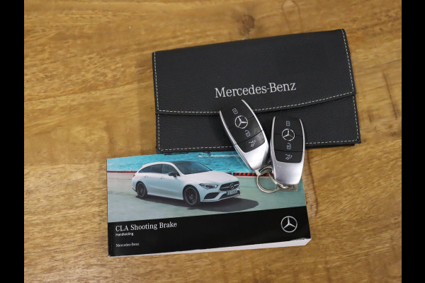 Mercedes-Benz CLA-Klasse Shooting Brake 200 Business Solution Luxury [CARPLAY, CRUISE CONTROL,SCHUIFKANTELDAK,  SFEERVERLICHTING, DIGITAL DASH, TREKHAAK, MEMORY SEATS, STOELVERWARMING, CAMERA + PDC, MERCEDES-BENZ KOPLAMPEN, VOL LEDER, NAVIGATIE, NIEUWSTAAT]