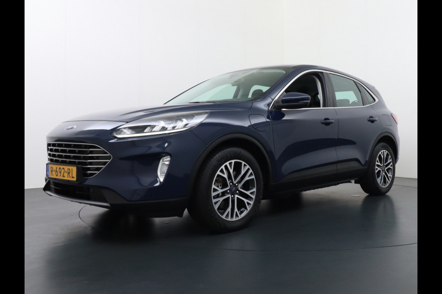Ford Kuga 2.5 PHEV 225pk Aut. Hybride Navi Camera Apple Carplay Android Ford-Connect PDC a+v 18" DAB Dual-ECC Stoelverwarmd Cruise Control Led Bluetooth Active Braking/Pre-Collision Assist Lane Assist en Road Edge Detection Voicecontrol EURO 6