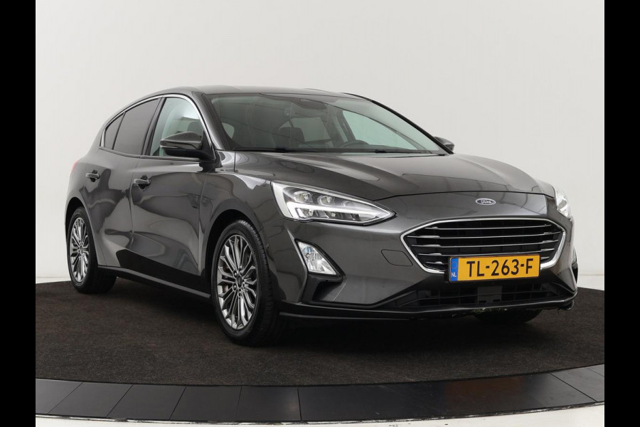 Ford Focus 1.0 EcoBoost Titanium | Stoel & stuurverwarming | Camera | Adaptive cruise | Carplay | B&O Sound | Navigatie | Full LED | Climate control