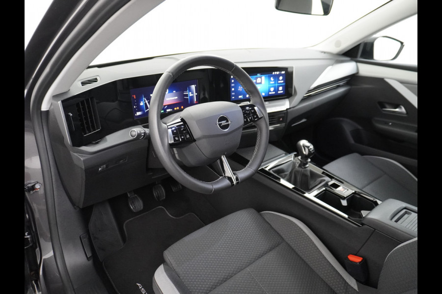 Opel Astra 1.2 T111PK Apple Carplay Navi-App Pure-Panel Virtual Cockpit PDC-v+a Keyless Ecc Led-a+v DAB+ Cruise Control Lmv Lane Assist Mistlamp Led Regensensor Hill Start Assist Rijstrooksensor met correctie Hill hold functie AEB ESPVermoeidheids herkenning Regensensor Verkeersbord detectie Mirror Screen Elektrisch verstelbare en verwarmbare buitenspiegels EURO6.4 Qi-lader Draadloos Orig.NLse auto slechts 35.600km! nieuwprijs € 33.500