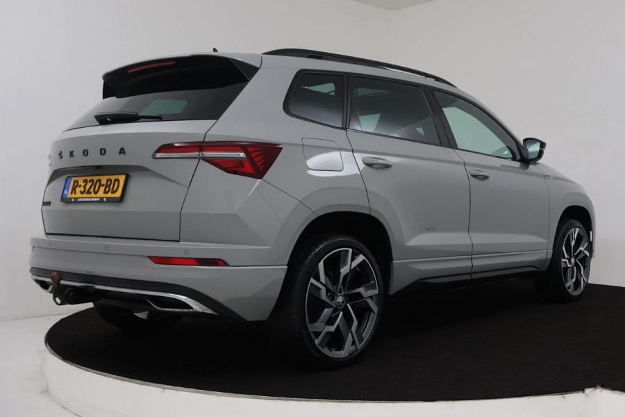 Škoda Karoq 1.5 TSI ACT Sportline Business (PANORAMADAK, STOEL-/STUURVERWARMING, ELEKT. TREKHAAK, ADAPTIVE CRUISE, CAMERA)