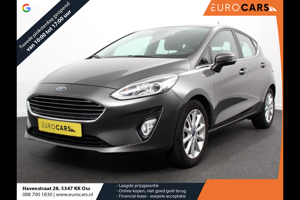 Ford Fiesta 1.0 EcoBoost 125pk Titanium | Navigatie | Apple Carplay/Android Auto | Parkeersensor achter | Cruise Control | Stoel-en stuurverwarming | Verwarmde voorruit | Climate Control Ford Fiesta 1.0 EcoBoost 125pk Titanium | Navigatie | Apple Carplay/Android Auto | Parkeersensor achter | Cruise Control | Stoel-en stuurverwarming | Verwarmde voorruit | Climate Control