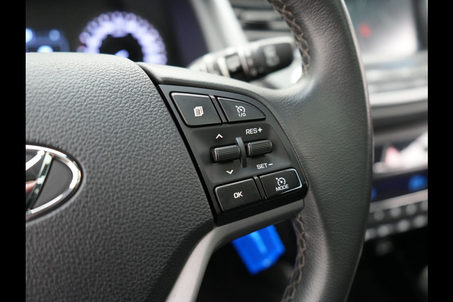 Hyundai Tucson 1.6 T-GDI Premium Automaat | Panodak | Lederen Sportstoelen Verwarmd | Trekhaak Afneembaar | Apple Carplay | Navigatie | Cruise Control | Climate Control | Camera | L.M. 19" |