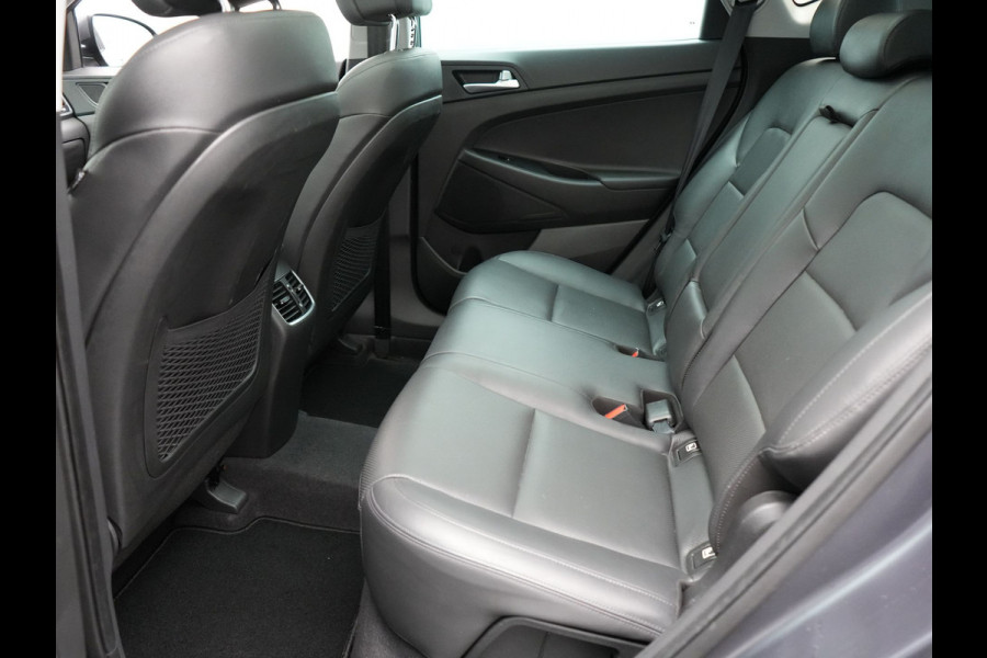 Hyundai Tucson 1.6 T-GDI Premium Automaat | Panodak | Lederen Sportstoelen Verwarmd | Trekhaak Afneembaar | Apple Carplay | Navigatie | Cruise Control | Climate Control | Camera | L.M. 19" |