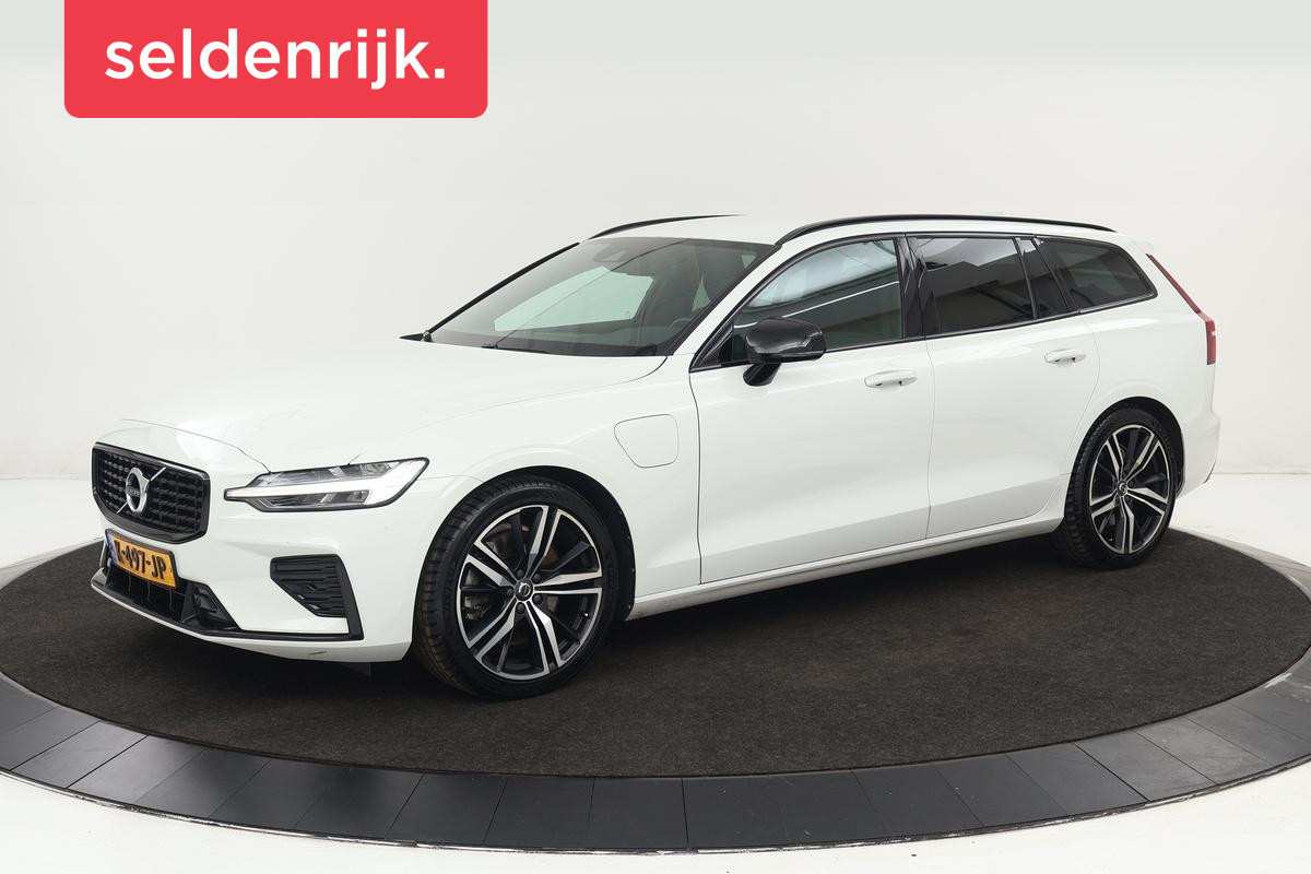 Volvo V60 2.0 T6 Recharge AWD R-Design | Camera | Stoel & stuurverwarming | Trekhaak | Adaptive cruise | Carplay | Keyless | Dodehoek detectie | Navigatie | Half leder | Full LED | PHEV Volvo V60 2.0 T6 Recharge AWD R-Design | Camera | Stoel & stuurverwarming | Trekhaak | Adaptive cruise | Carplay | Keyless | Dodehoek detectie | Navigatie | Half leder | Full LED | PHEV
