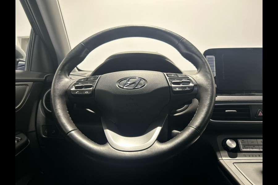 Hyundai Kona EV Premium 64 kWh | Warmtepomp | Verwarmde en geventileerde stoelen | Soh (batterijcheck) 91,8 %