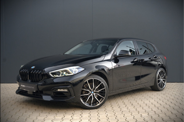 BMW 1-serie 118i High Executive Edition | Virtual Dash | Apple Carplay | Stoelverwarming | Leer | Led | Keyless | PDC | Shadow Line | Automaat | M Sport Stuur | Climate Control | Cruise Control |
