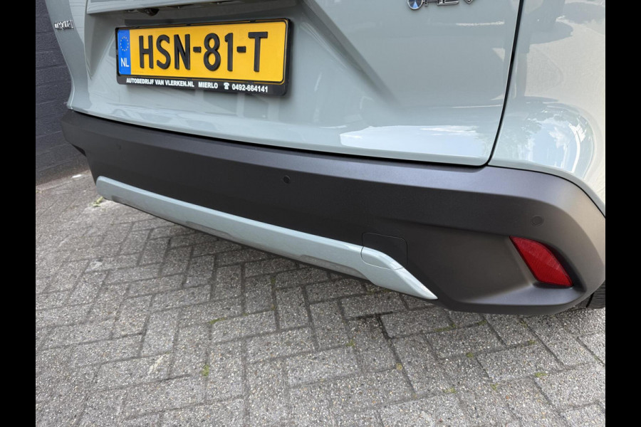 Toyota Corolla Cross Hybrid 140 Dynamic ook in kleur zwart en blauw