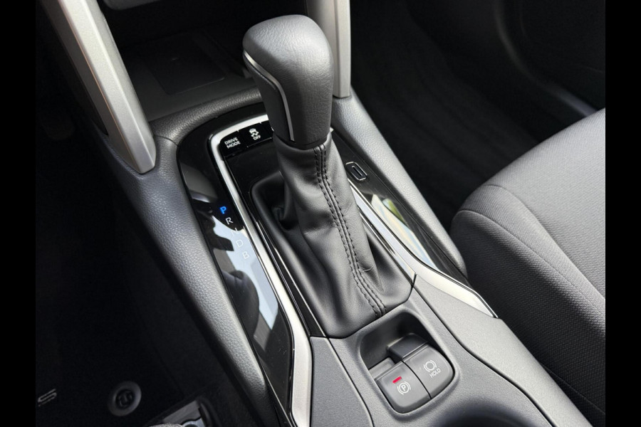 Toyota Corolla Cross Hybrid 140 Dynamic ook in kleur zwart en blauw