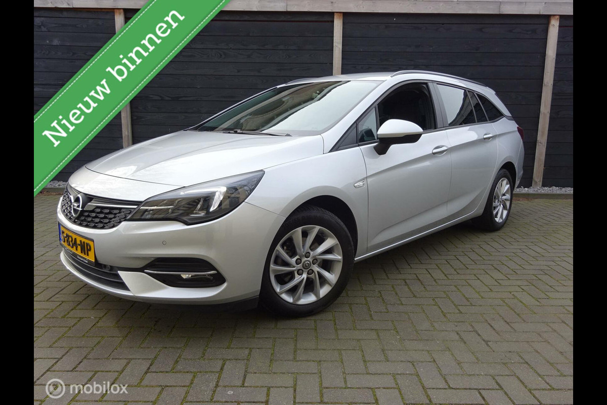 Opel Astra Sports Tourer 1.2 145PK!!! Edition FM nav / Stoel-stuur verwarming / 36.845 KM!!! Opel Astra Sports Tourer 1.2 145PK!!! Edition FM nav / Stoel-stuur verwarming / 36.845 KM!!!