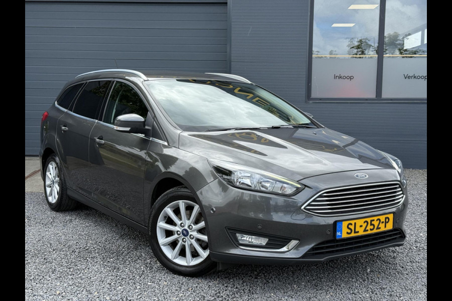 Ford FOCUS Wagon 1.0 Titanium 2e Eigenaar,125pk,Navi,Trekhaak,Stuurverwarming,Stoelverwarming,6 Bak,Pdc,Lmv,Apk tot 04-2026