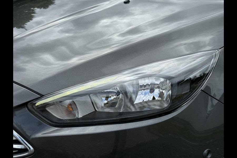Ford FOCUS Wagon 1.0 Titanium 2e Eigenaar,125pk,Navi,Trekhaak,Stuurverwarming,Stoelverwarming,6 Bak,Pdc,Lmv,Apk tot 04-2026