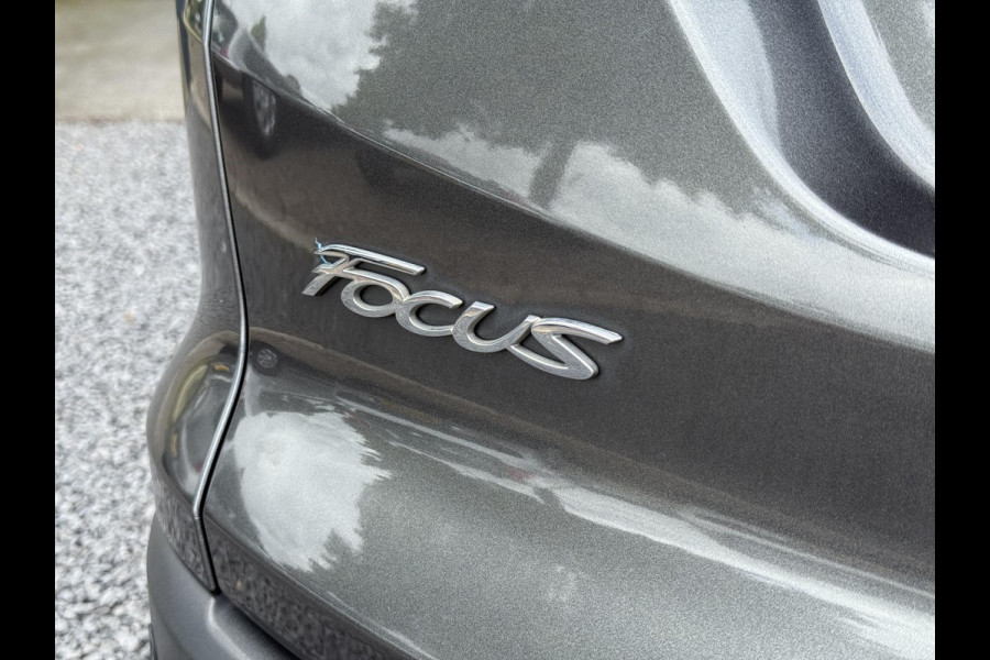 Ford FOCUS Wagon 1.0 Titanium 2e Eigenaar,125pk,Navi,Trekhaak,Stuurverwarming,Stoelverwarming,6 Bak,Pdc,Lmv,Apk tot 04-2026