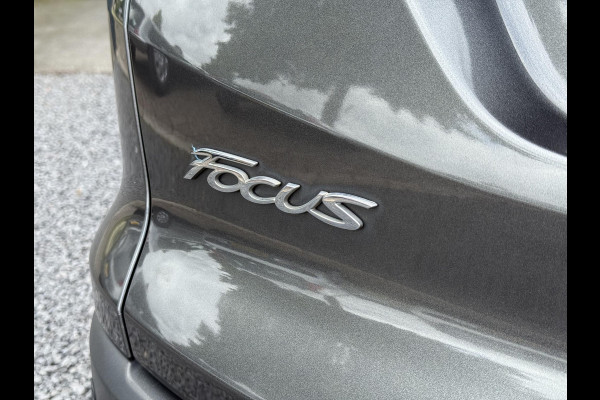 Ford FOCUS Wagon 1.0 Titanium 2e Eigenaar,125pk,Navi,Trekhaak,Stuurverwarming,Stoelverwarming,6 Bak,Pdc,Lmv,Apk tot 04-2026
