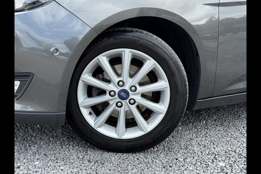 Ford FOCUS Wagon 1.0 Titanium 2e Eigenaar,125pk,Navi,Trekhaak,Stuurverwarming,Stoelverwarming,6 Bak,Pdc,Lmv,Apk tot 04-2026