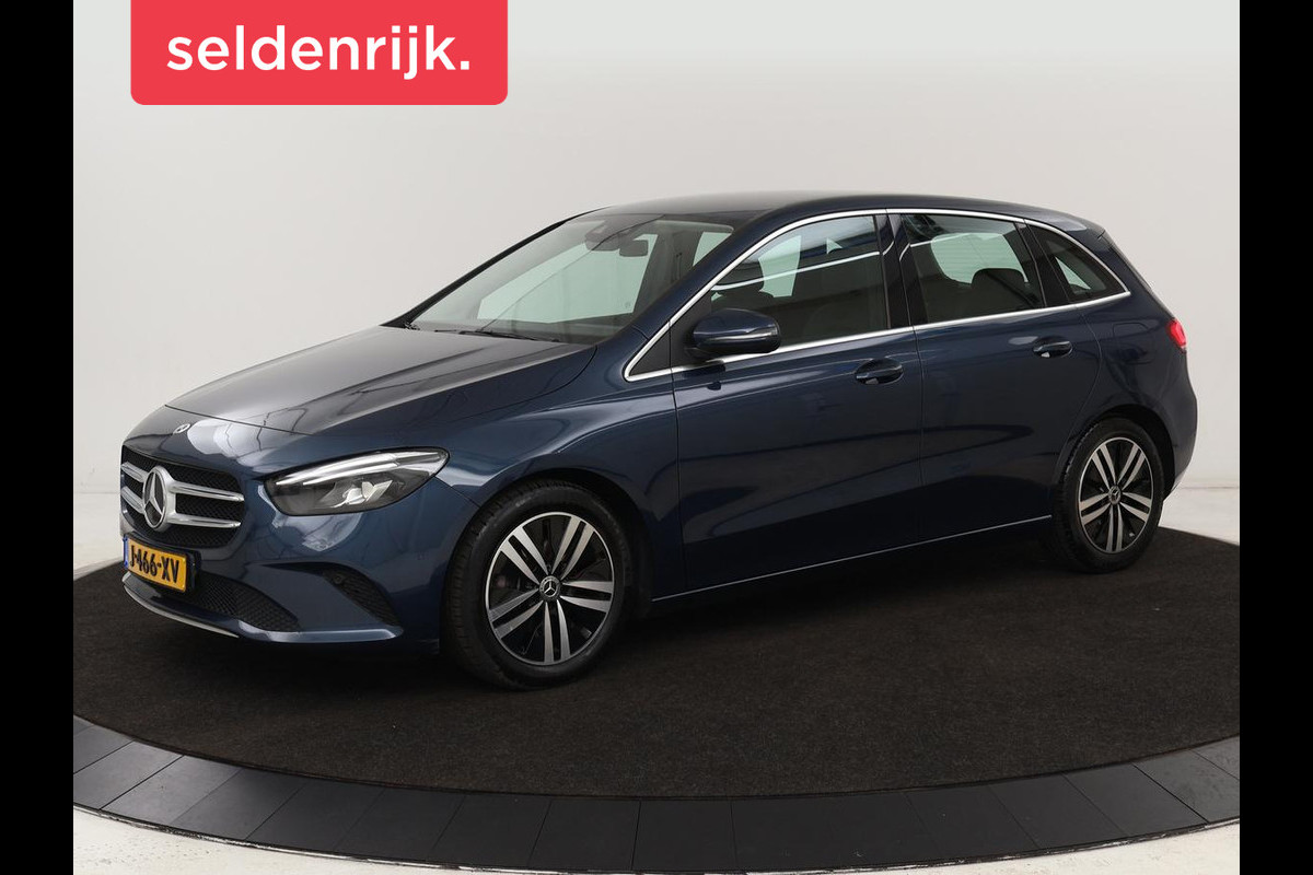 Mercedes-Benz B-Klasse 180 Business Solution Luxury | Leder | Trekhaak | Stoelverwarming | Camera | Navigatie | Full LED | Park Assist | Sfeerverlichting | Widescreen Mercedes-Benz B-Klasse 180 Business Solution Luxury | Leder | Trekhaak | Stoelverwarming | Camera | Navigatie | Full LED | Park Assist | Sfeerverlichting | Widescreen
