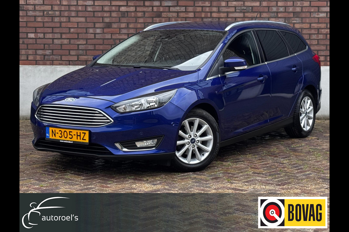 Ford FOCUS Wagon 1.0 Titanium / 125 PK / Trekhaak / Navigatie / Climate Control / Stoel + Stuurverwarming / Park Pilot Ford FOCUS Wagon 1.0 Titanium / 125 PK / Trekhaak / Navigatie / Climate Control / Stoel + Stuurverwarming / Park Pilot